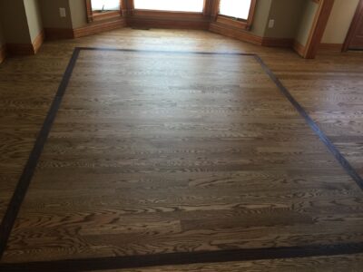 Special Walnut floor with a dark border in the great room, Saint Charles, IL