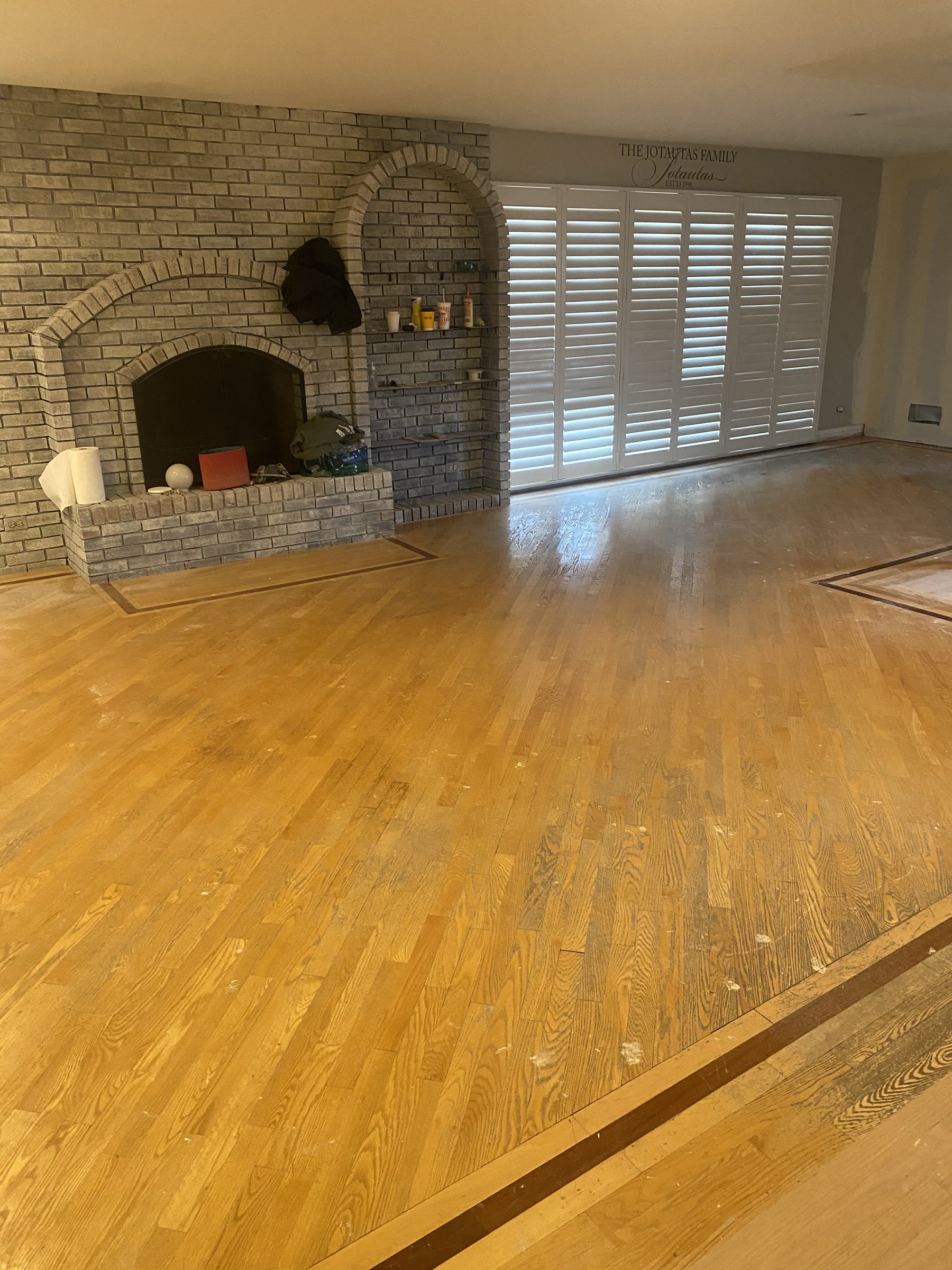 Worn, warm-toned floor before refinishing, West Chicago, IL