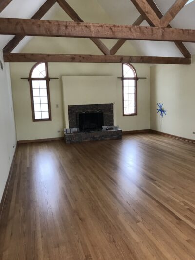 Golden Oak floor in the great room by the fireplace with wood beams, Western Springs, IL