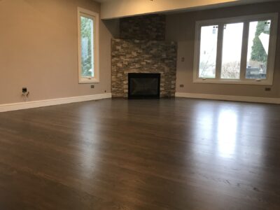 Custom greige hardwood floor in the great room with a fireplace, Western Springs, IL