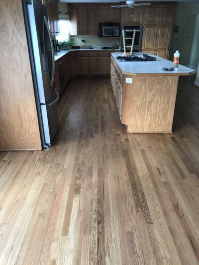 Repaired kitchen floor sanded to bare wood before staining, Western Springs, IL (in-process)