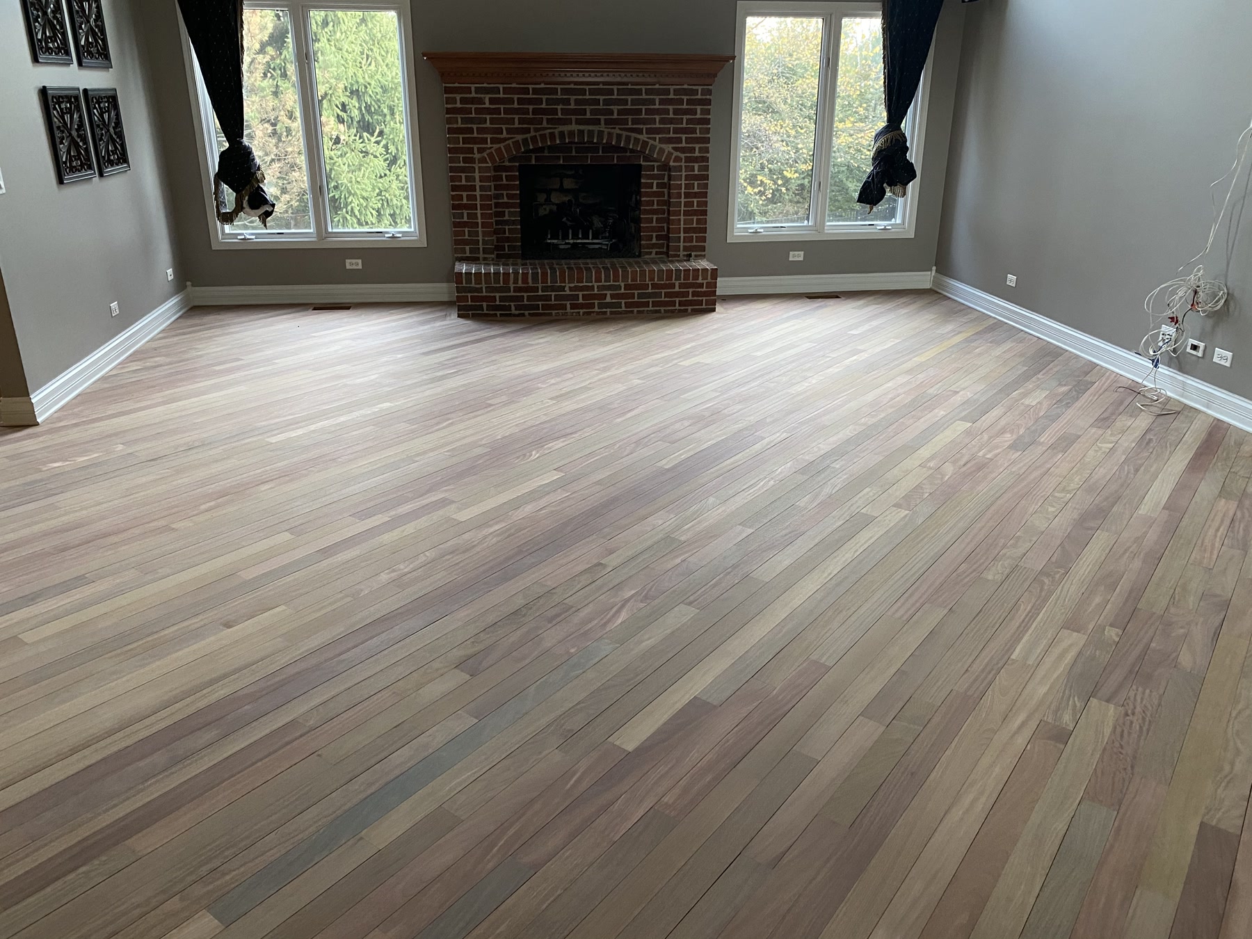 Brazilian cherry floor sanded to a dull, bare tone before refinishing, Wilmette, IL