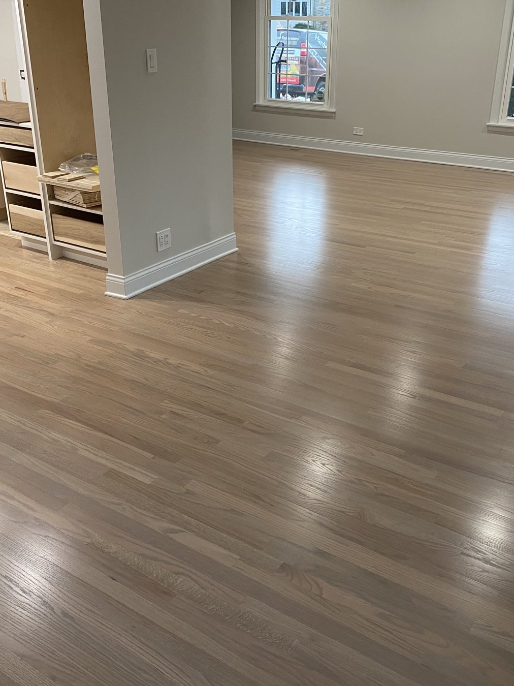 Silvered gray stained hardwood floor in a Yorkville living room