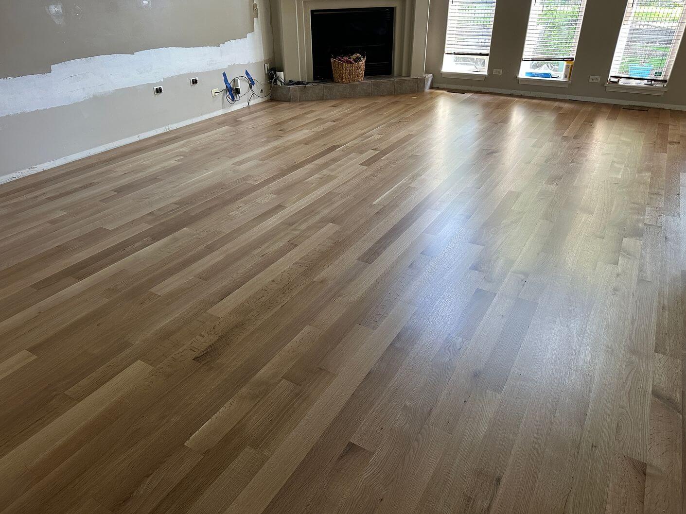 Newly installed white oak flooring after sanding and preparation for the natural finish.