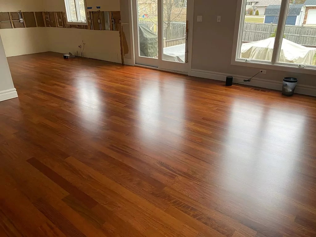 Shiny refinished hardwood floors with a rich color