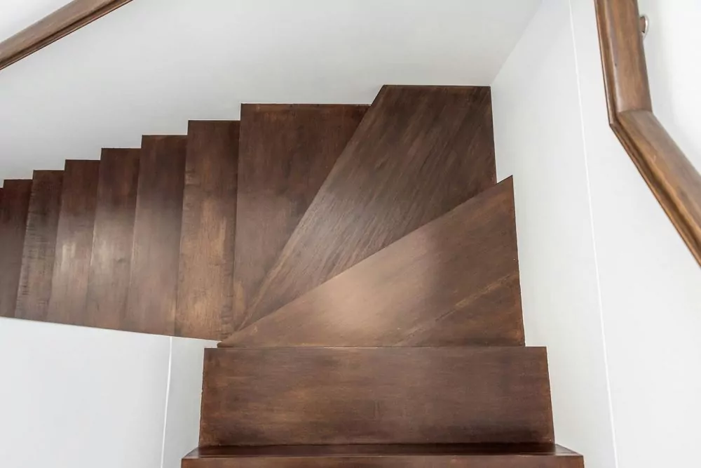 Dangerously slippery wood stairs polished with furniture polish.