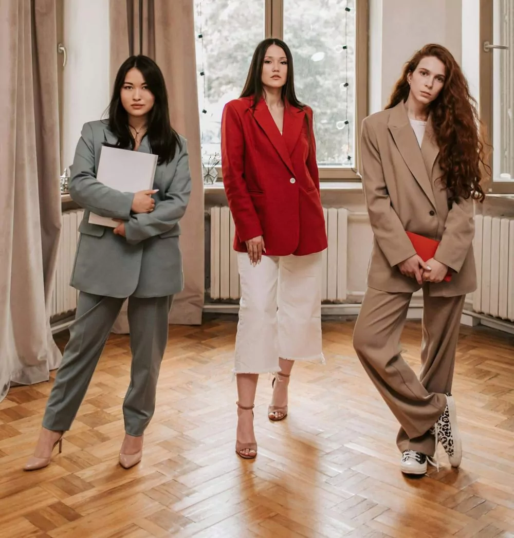 Three ladies wearing high heels damaging the polish.