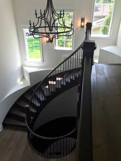 A staircase: refinishing solid hardwood project by Big Bro Hardwood.