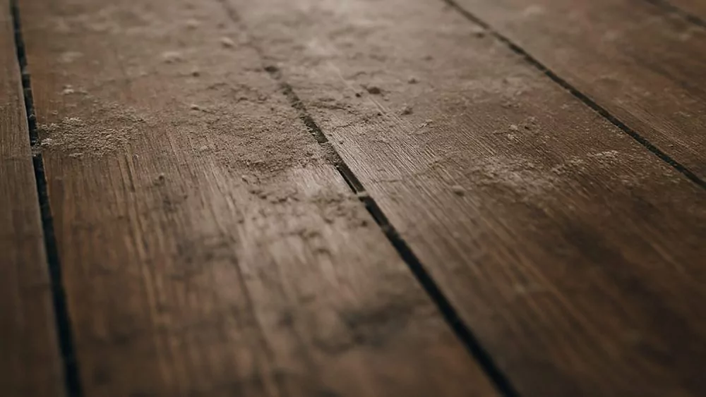 Dusty hardwood floors close look