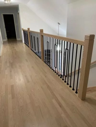 Light natural oak hardwood floor hallway, matte wood floor finish after refinishing.