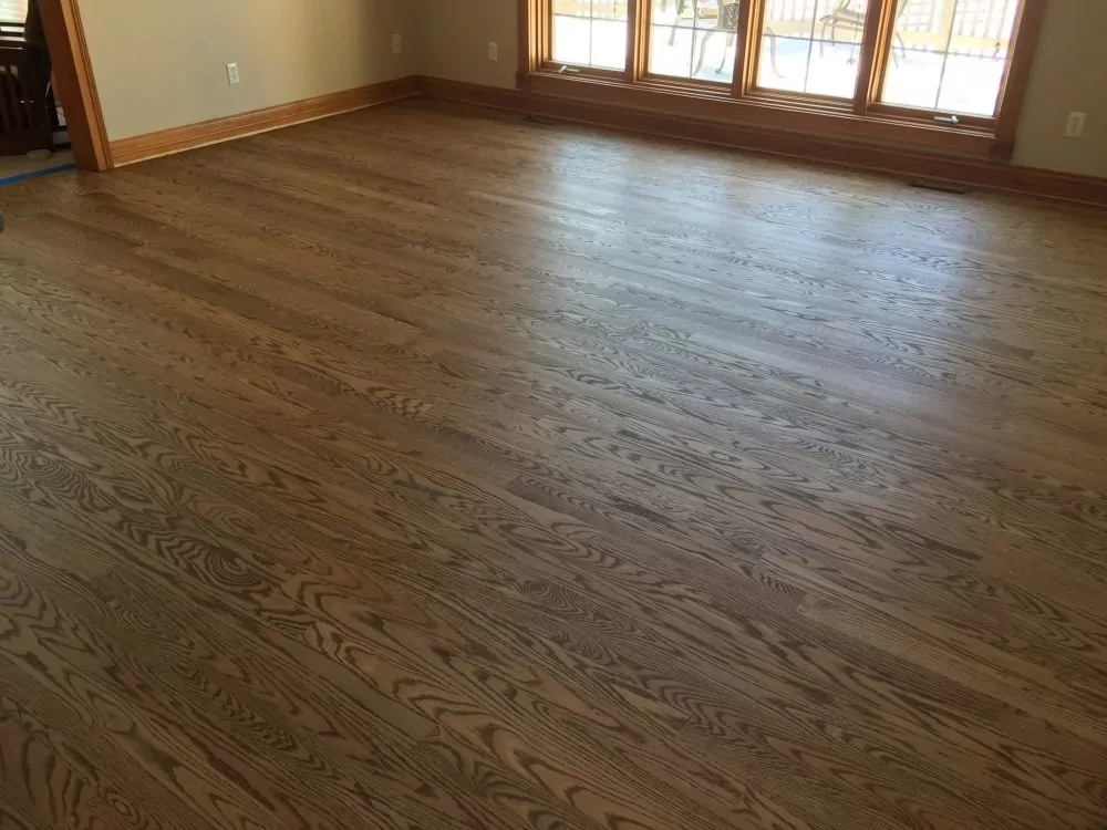 Spacious open room featuring oak hardwood flooring in a neutral Rubio Monocoat tone