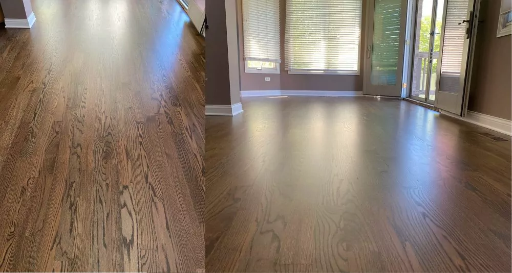 Open living room with provincial-stained hardwood floor and zooming floor on the left, which shows a premium finish choice that can raise material costs
