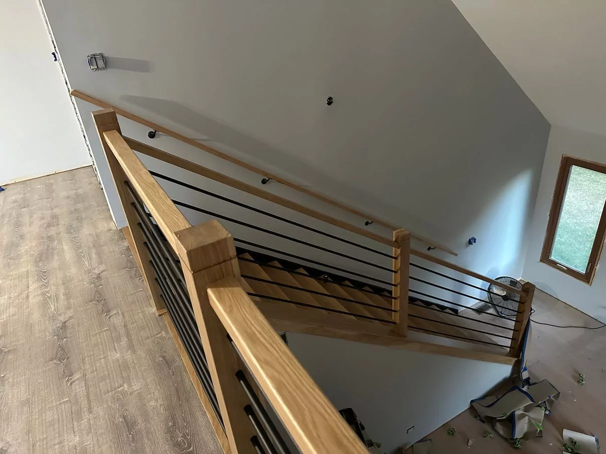 After stair railing installation: white oak posts and horizontal iron spindles in West Chicago, IL
