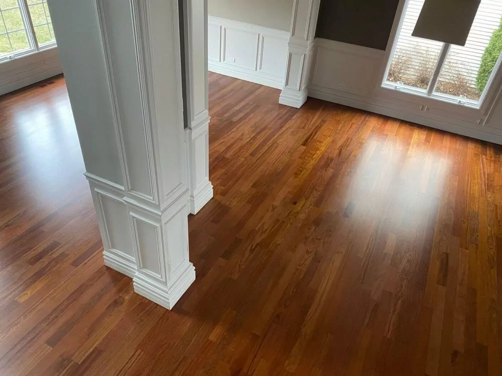 Brazilian cherry hardwood floor in a formal room, with the natural reddish-brown tone and dense surface typical of this exotic wood species